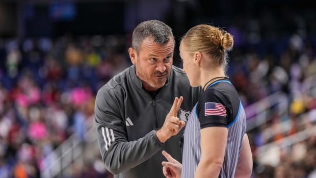 Mar 8, 2024; Greensboro, NC, USA; Louisville Cardinals head coach Jeff Walz talks with an official in the first half against the Notre Dame Fighting Irish at Greensboro Coliseum.